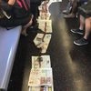 Subway Commuters Unfazed By Blood-Soaked Newspapers On 7 Train